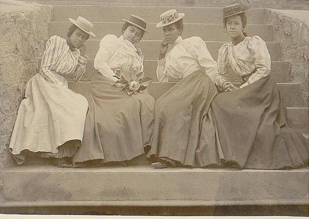 4 women seated on the steps of Atlanta University